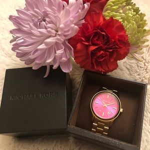 Michael Kors watch gold detail with pink face